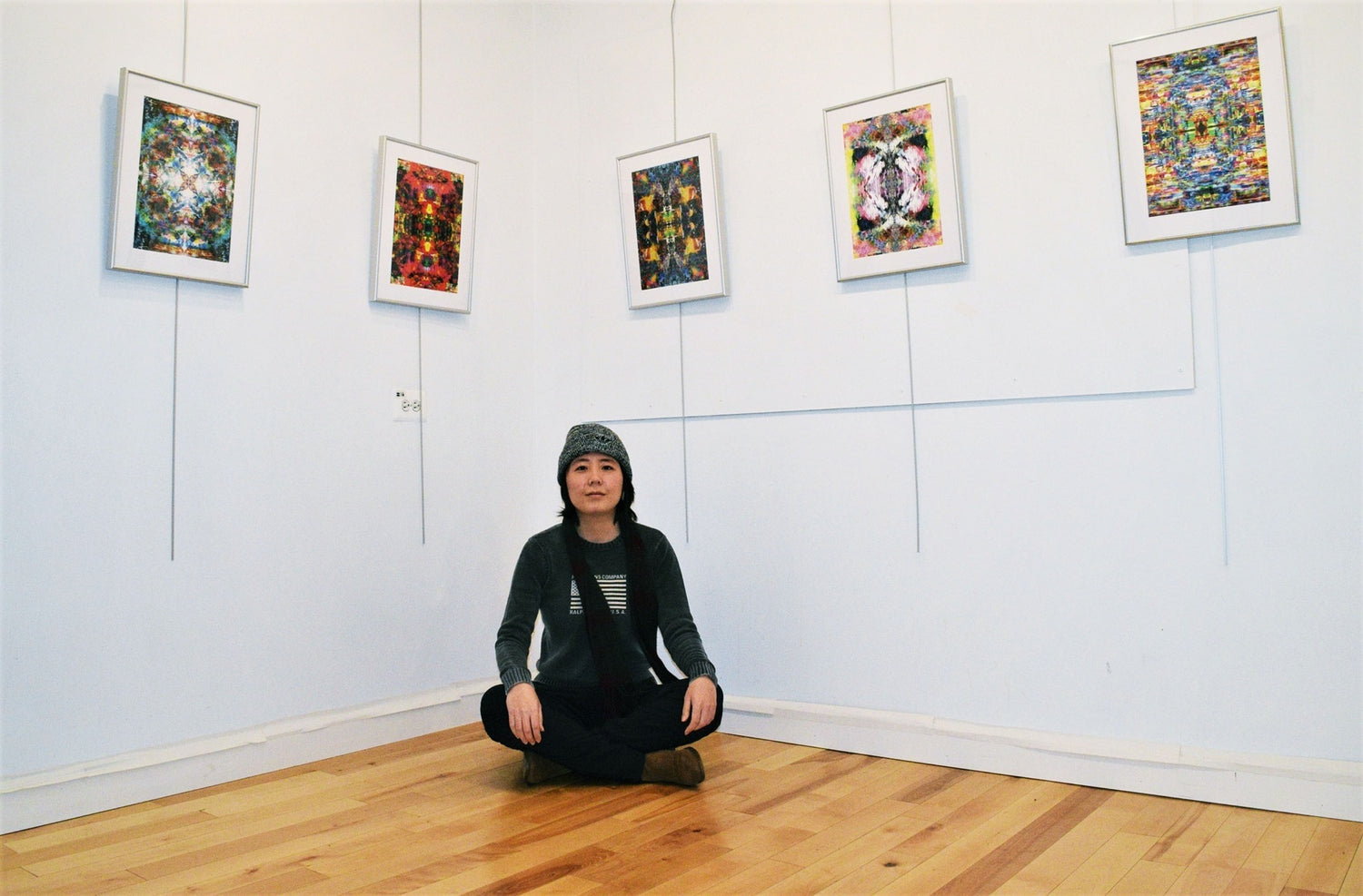 Artist Elaine B. Chao with her exhibited works- portrait